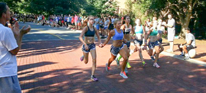 At the finish line in 2014, the first seven women elected to cross the finish together - setting a new Cake Race record. Photo courtesy of Lincoln Davidson and DavdsonNews.net