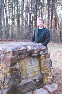 Jeff Lowrance standing near a cemetery