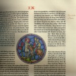 A page from Roland with a window image of a man with a crown on a horse with a woman surrounded by text