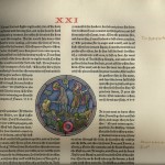 A page from Roland with a window image of a knight and a man with a horn surrounded by text