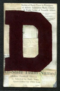 Vance's varsity "D" framed with news clippings about his sports achievements.