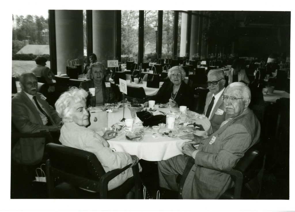 Kalista Hood Hart and W. Lewis Hart are in the foreground of this group photo, taken at the 60th anniversary reunion for the class of 1930.