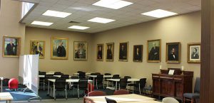 Former Presidential library corner with portraits of previous presidents