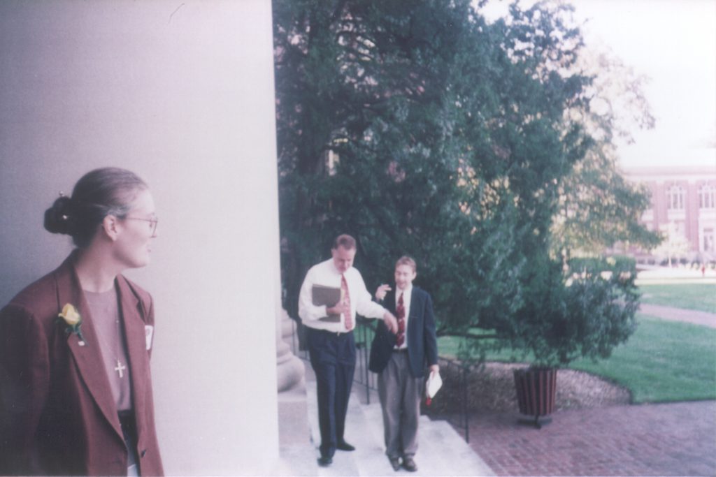 Jan stands by one of the columns of the Chambers Building in 1997, while then Library Director Leland Park chats with Josh Gaffga.
