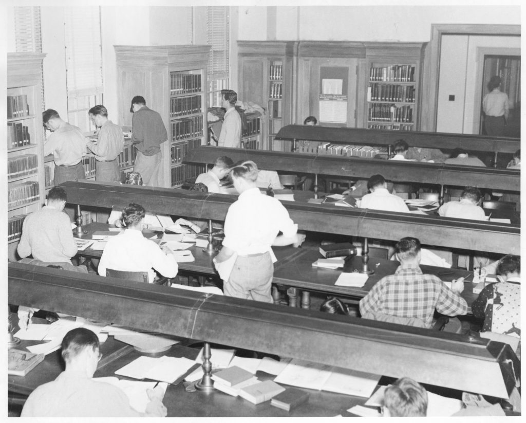 Many students studying in the reading room of Grey Library, circa 1960