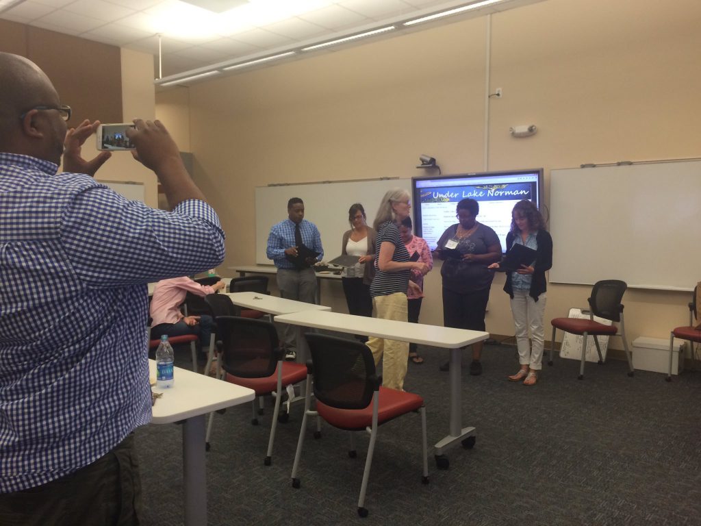 Hilton Kelly is photographed while photographing Jan (meta!) working with Charlotte Mecklenburg public school teachers on a workshop in summer 2016, aimed at integrating archival materials across secondary education.